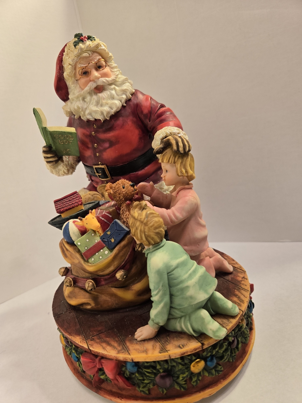Holiday Santa with Children Figurine - Red, Green, Cream
